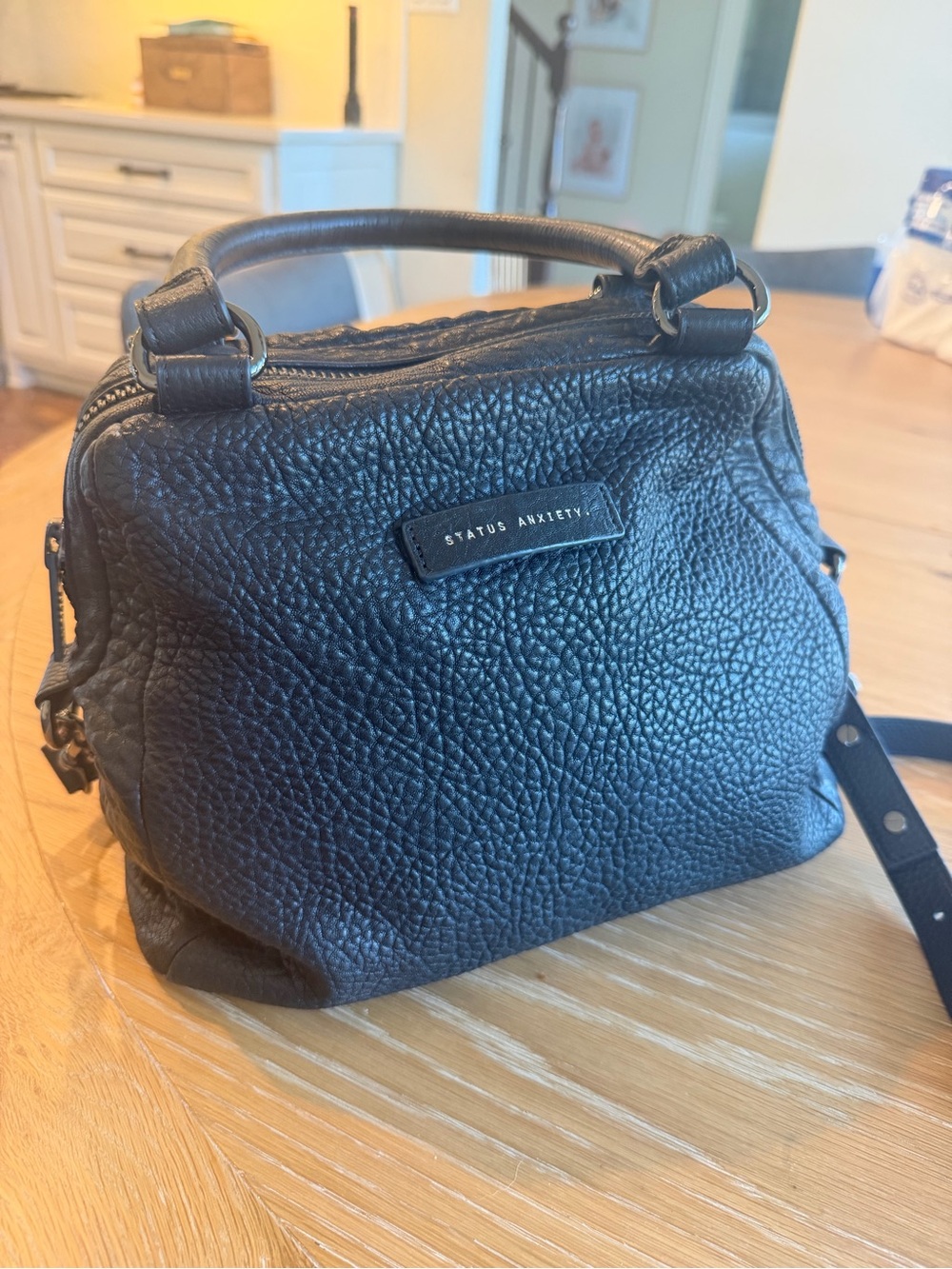 Status Anxiety last mountains pebbled black leather bag